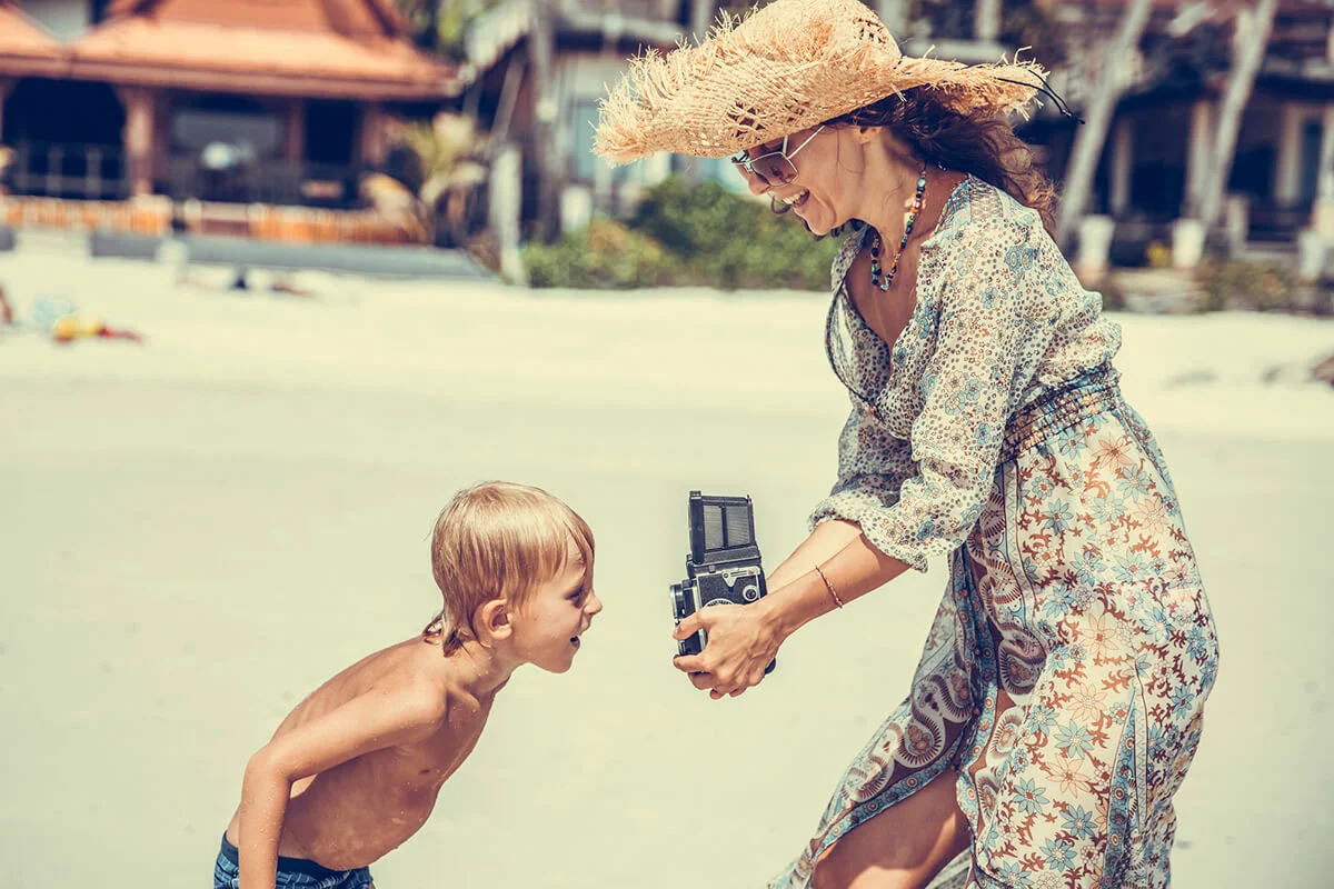 Woman taking photo of her kid