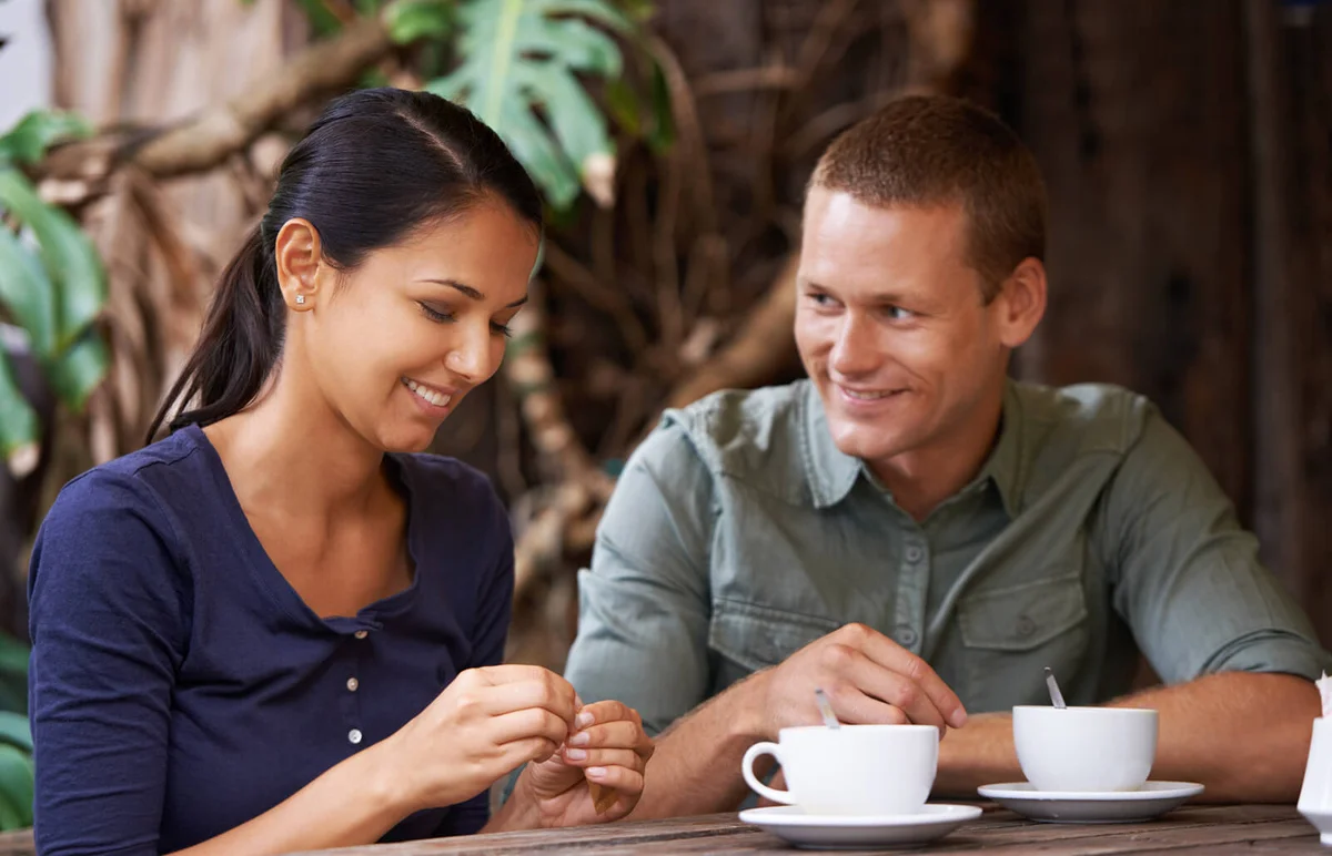 Young couple drinking coffee at a restaurant