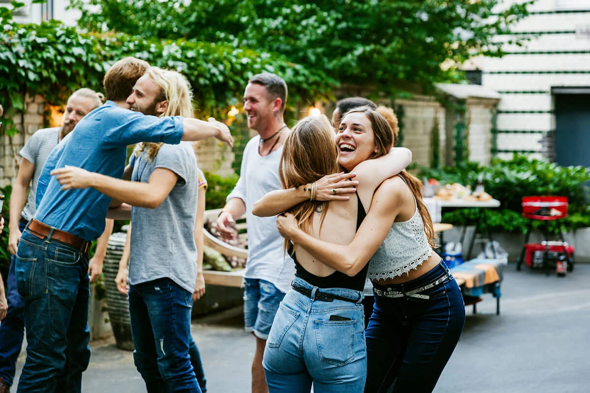 Young Group Of Friends Meeting Up For Barbecue