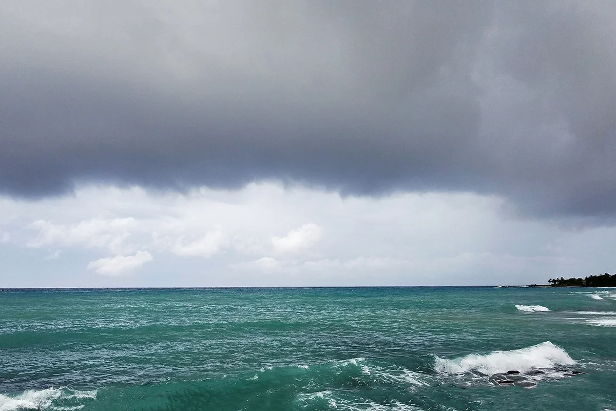 Crashing ocean waves and storm clouds