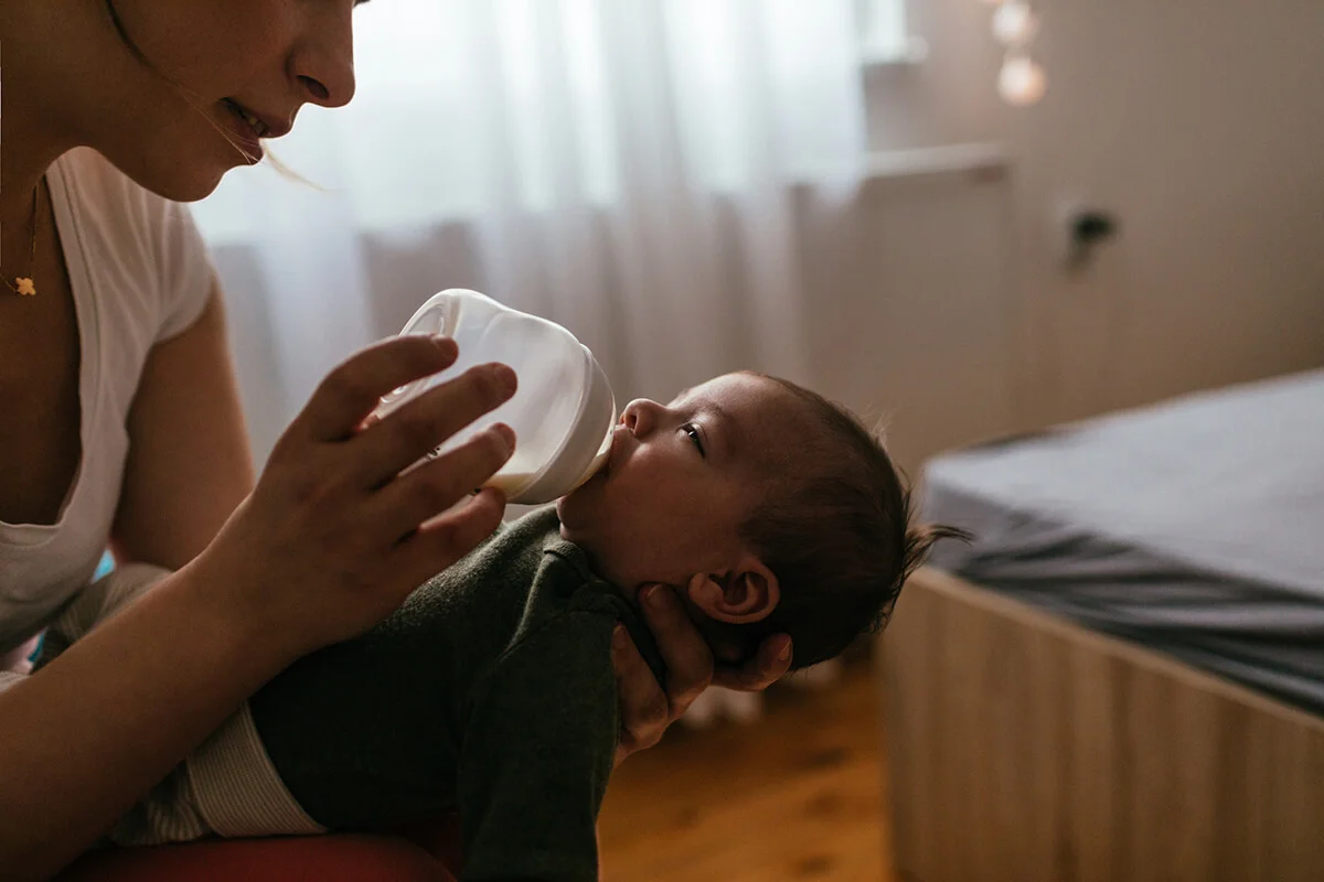 Mommy feeding her newborn baby