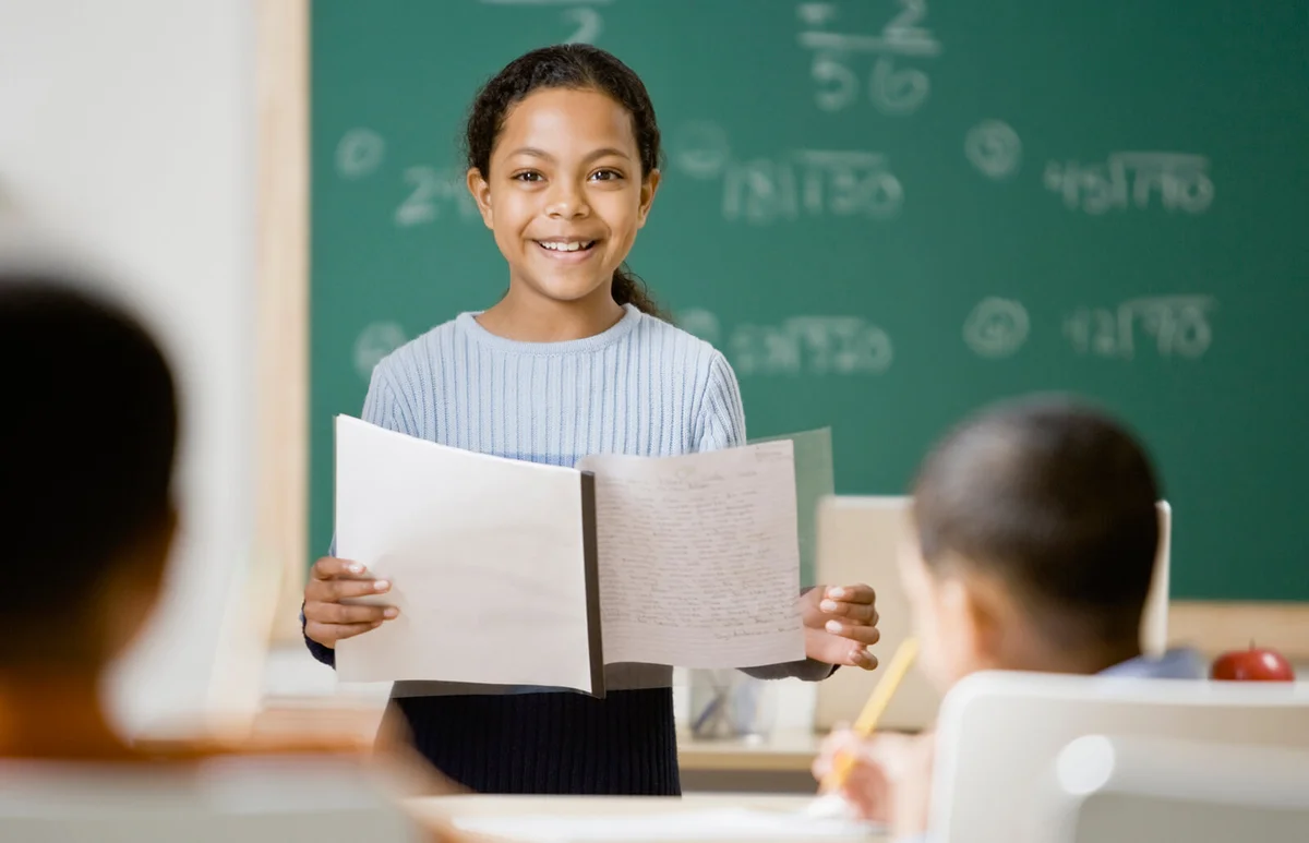 girl giving presentation in school