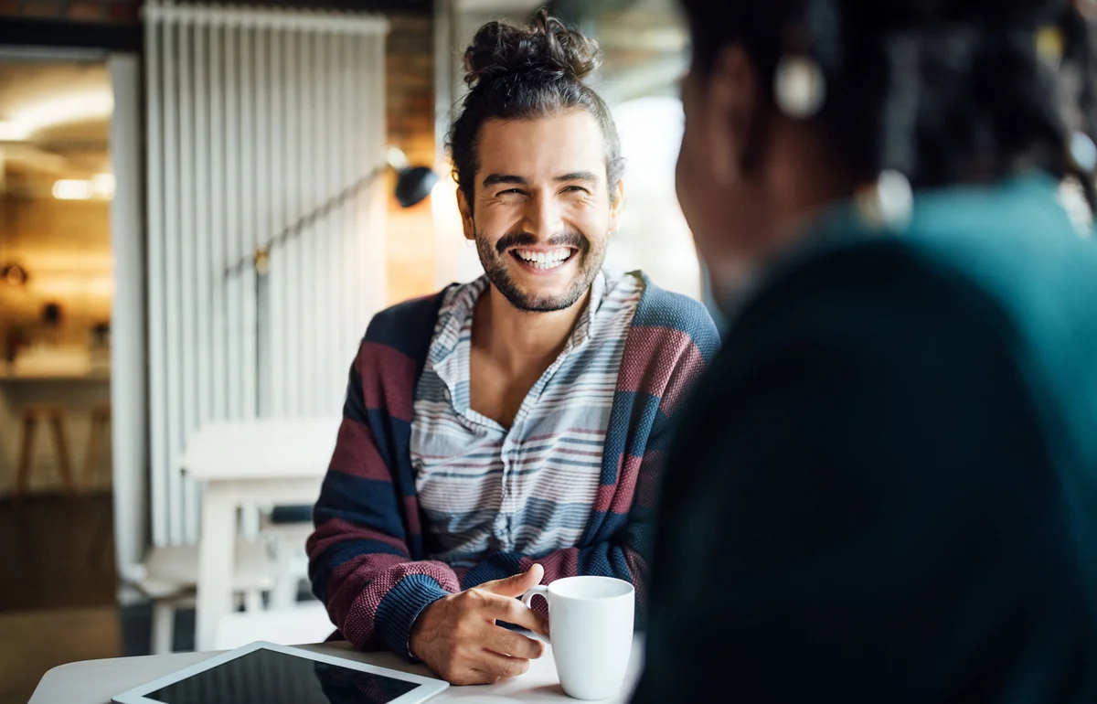 Men talking in cafe
