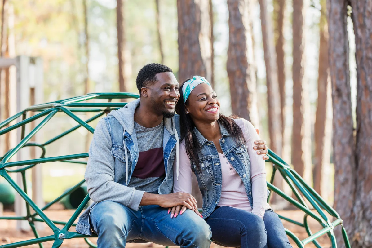 Couple hanging out on playground