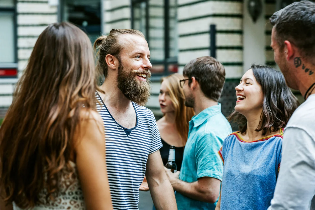 Group of friends laughing at party