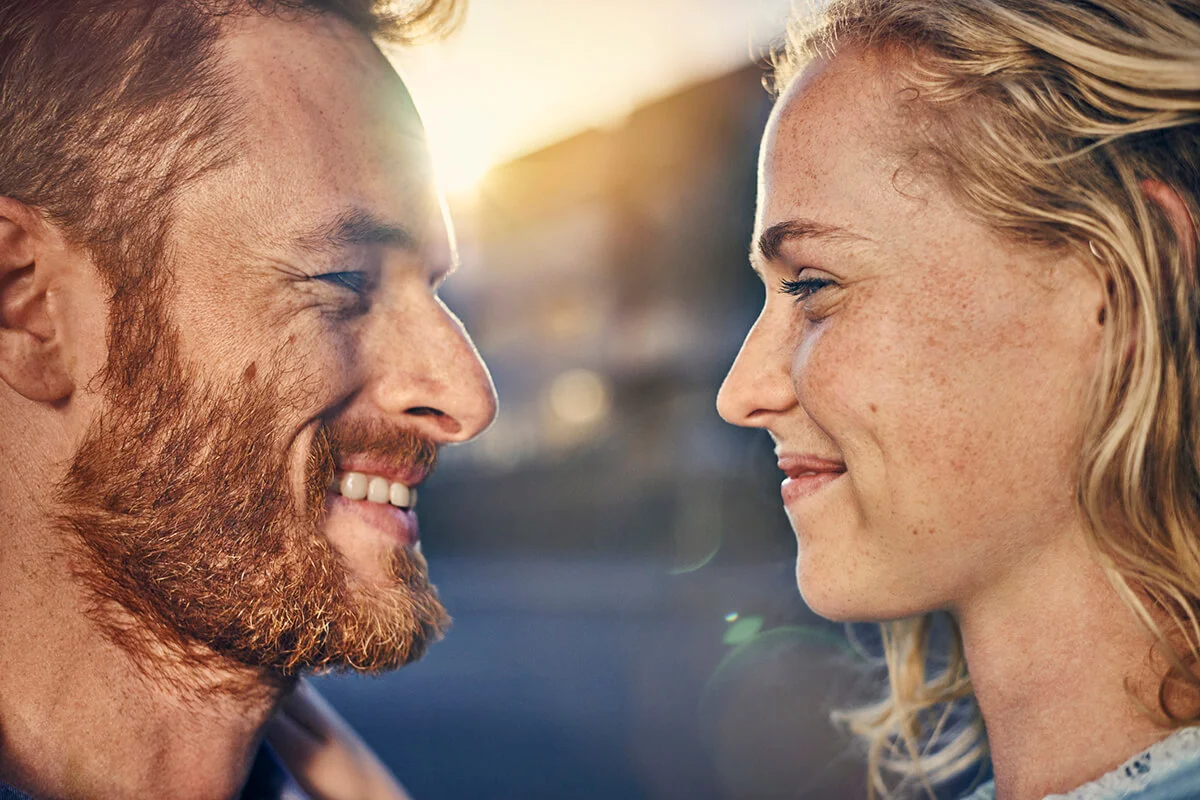 Young couple smiling at each other