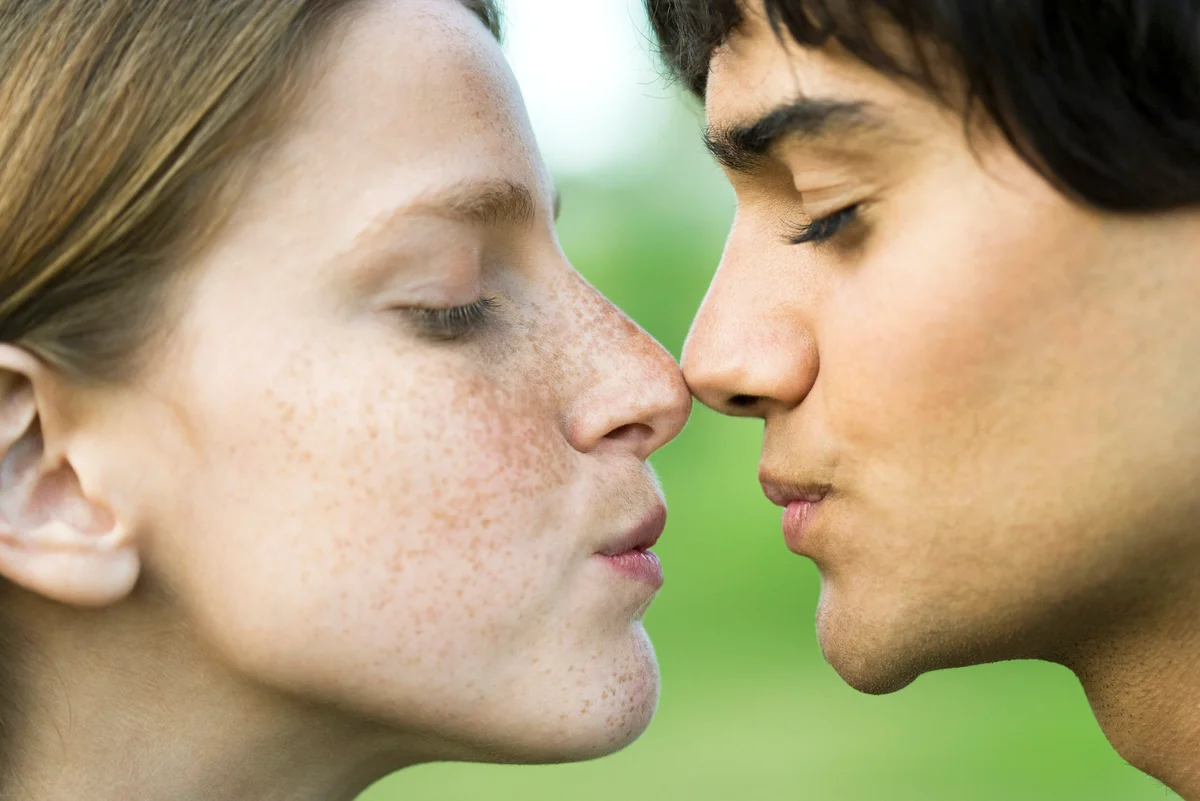 Young couple about to kiss