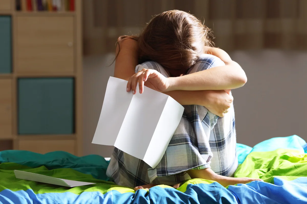Sad woman after reading a letter
