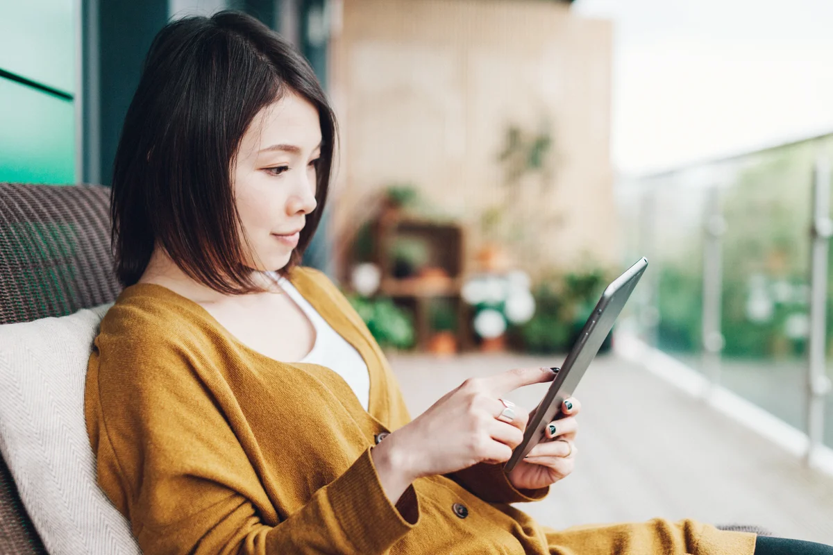 Woman reading on a tablet