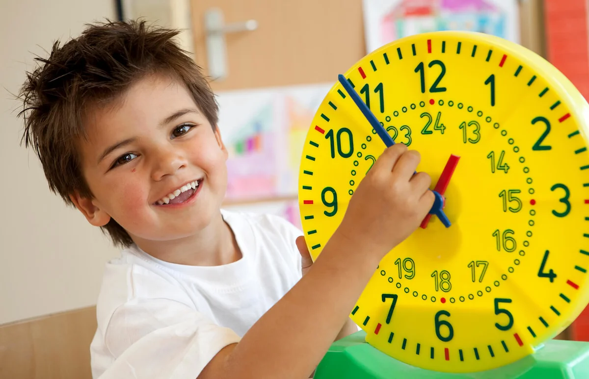 Little boy learning the clock