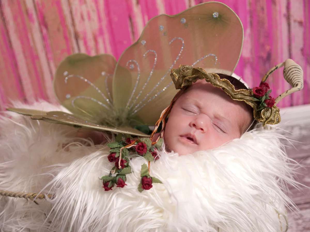 Newborn baby dressed like a fairy