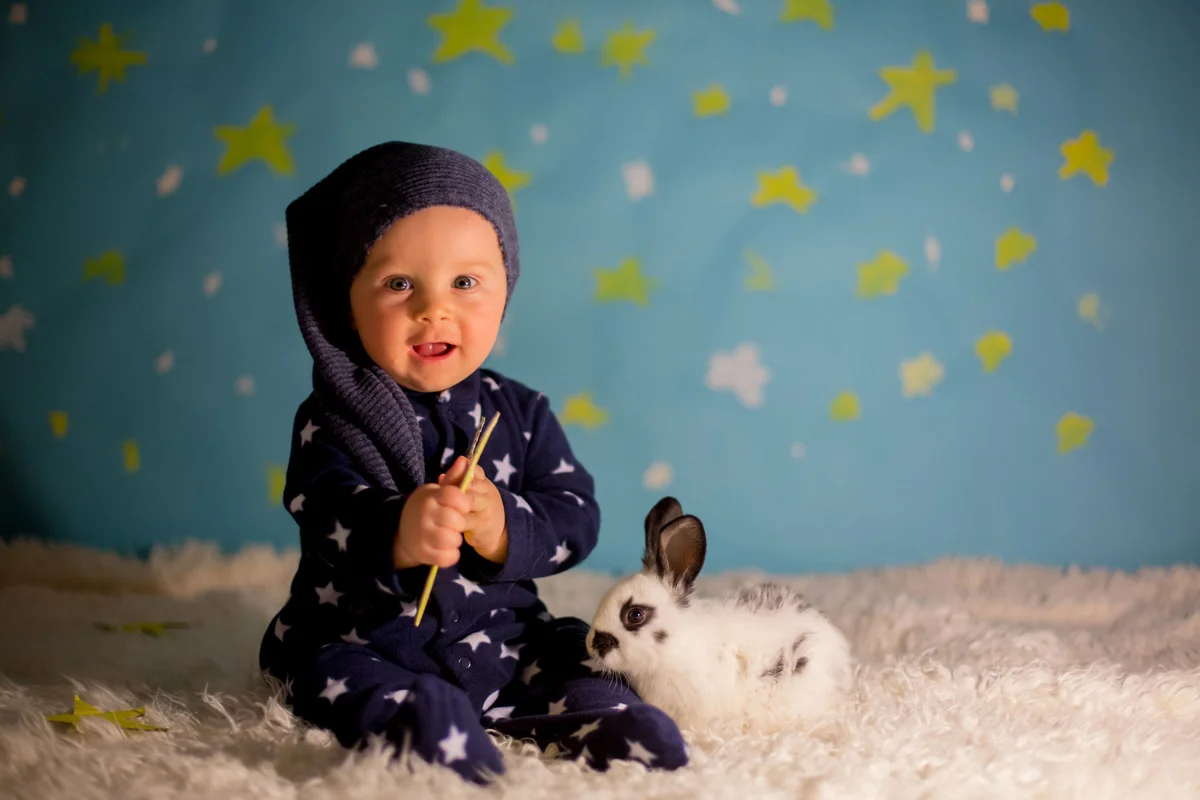 Baby with rabbit in star outfit