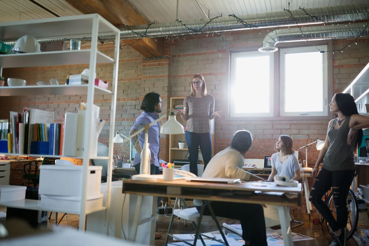 Designer leading a company meeting