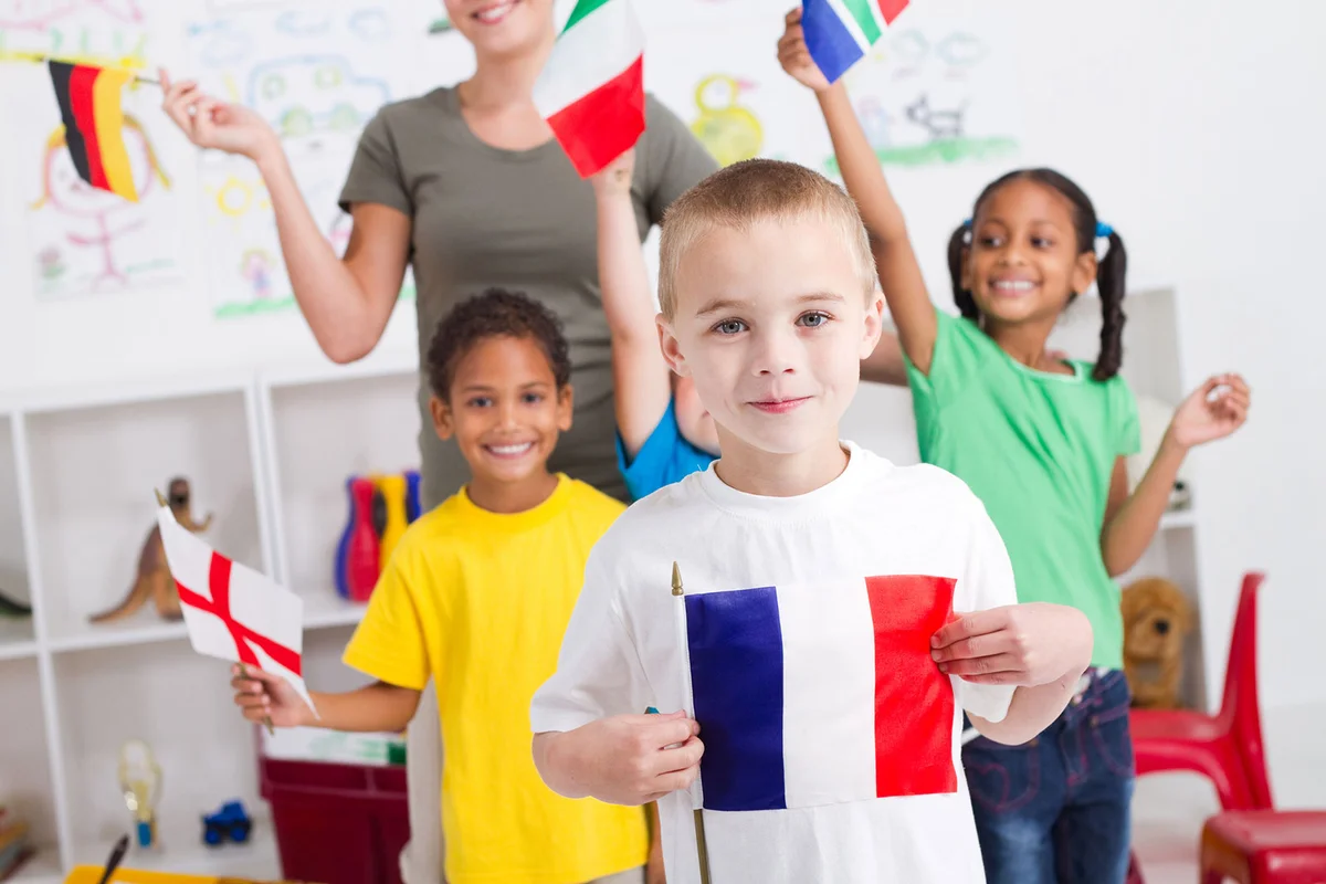 School kids and teacher with flags