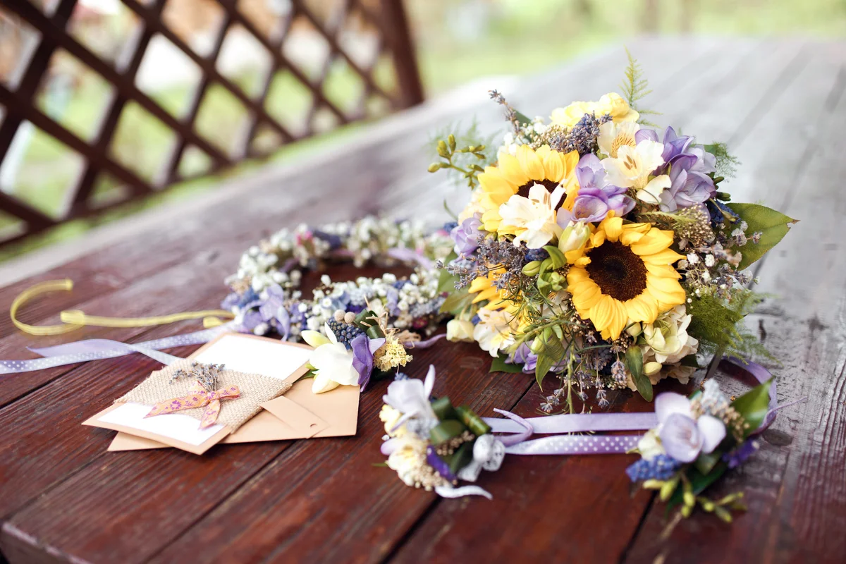 wedding bouquet, wreath and invitations at daylight