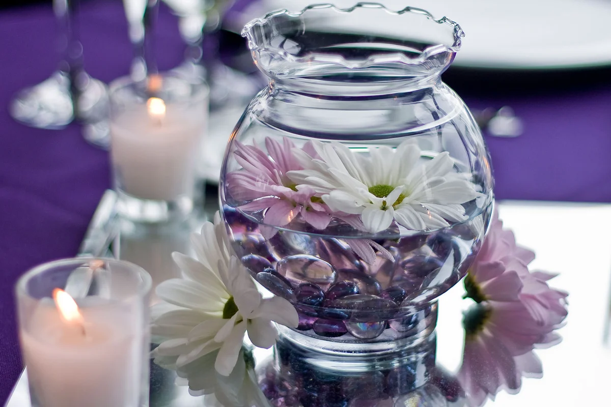 Centerpiece of Daisy Flowers, Marbles, and Candles