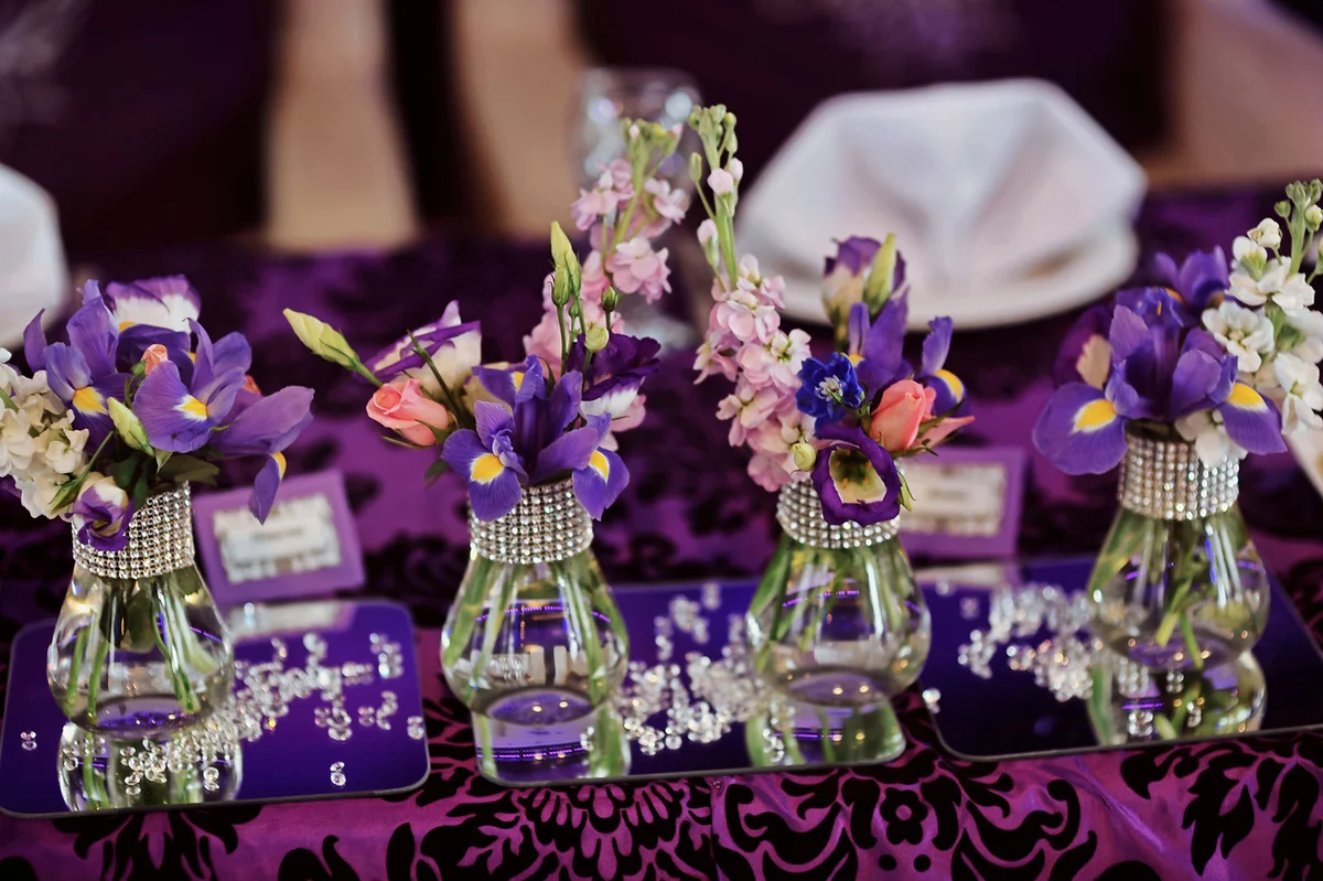 Wedding table decoration with iris arrangements