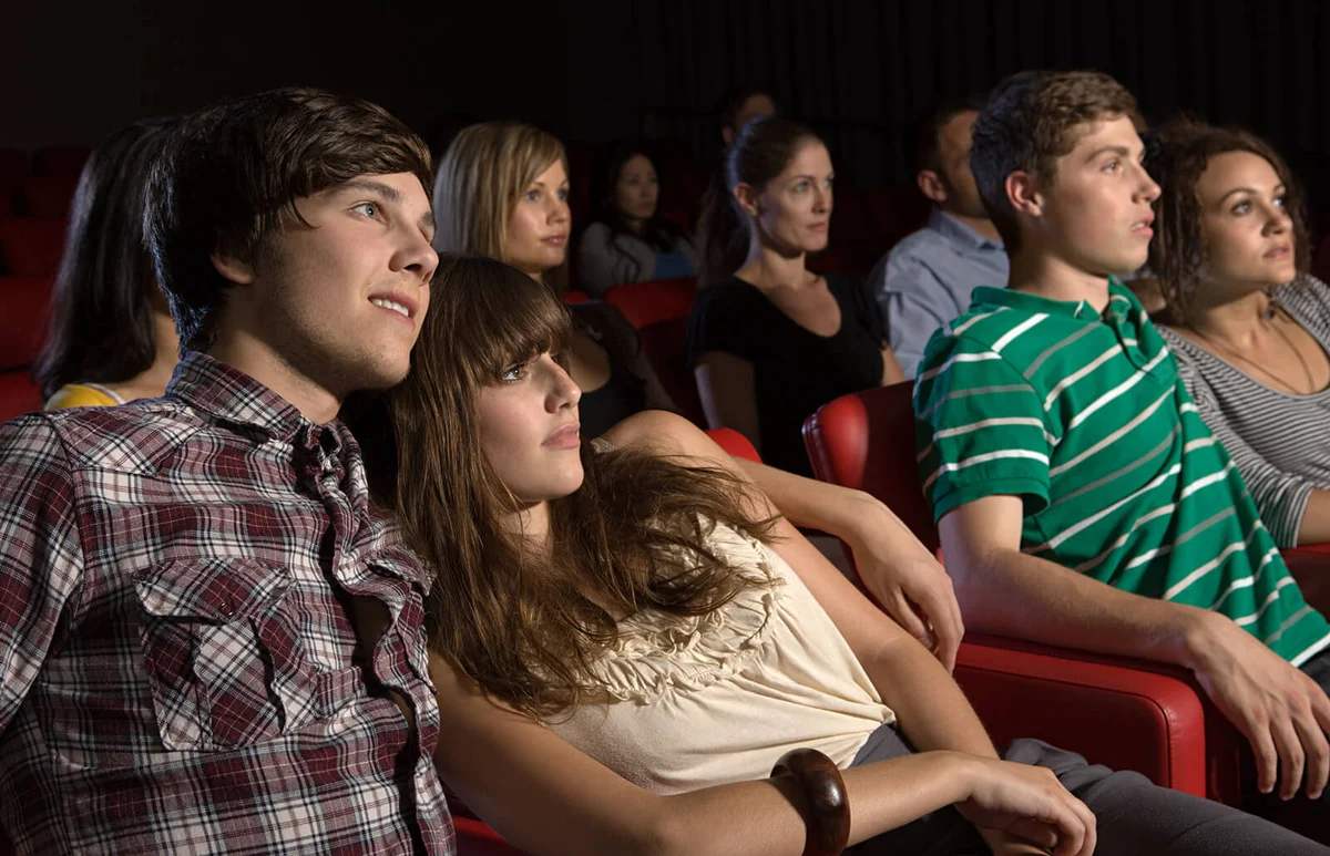 Young couples watching a movie