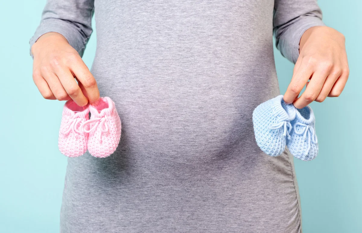 Pregnant woman with 2 sets of booties