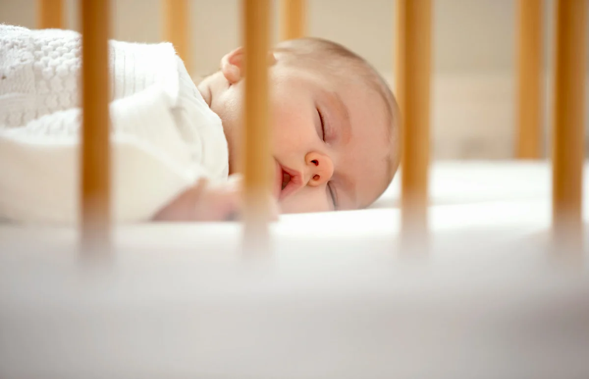 Baby sleeping in crib