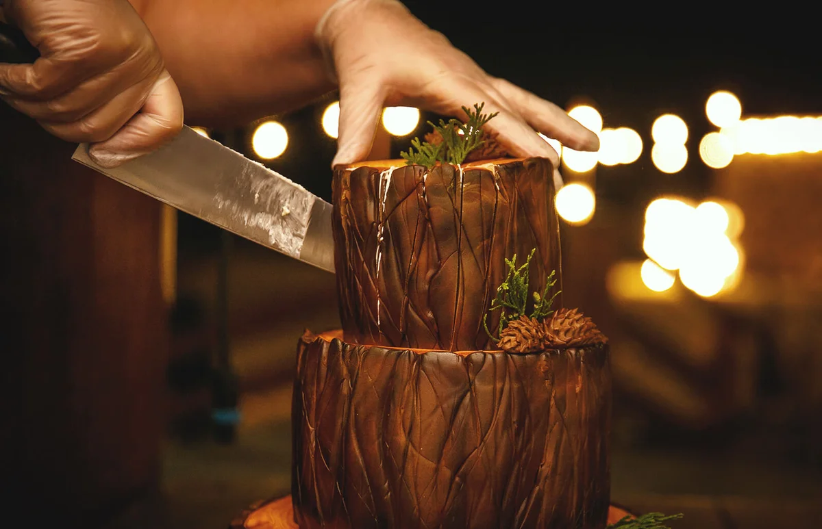Cutting chocolate brownie cake