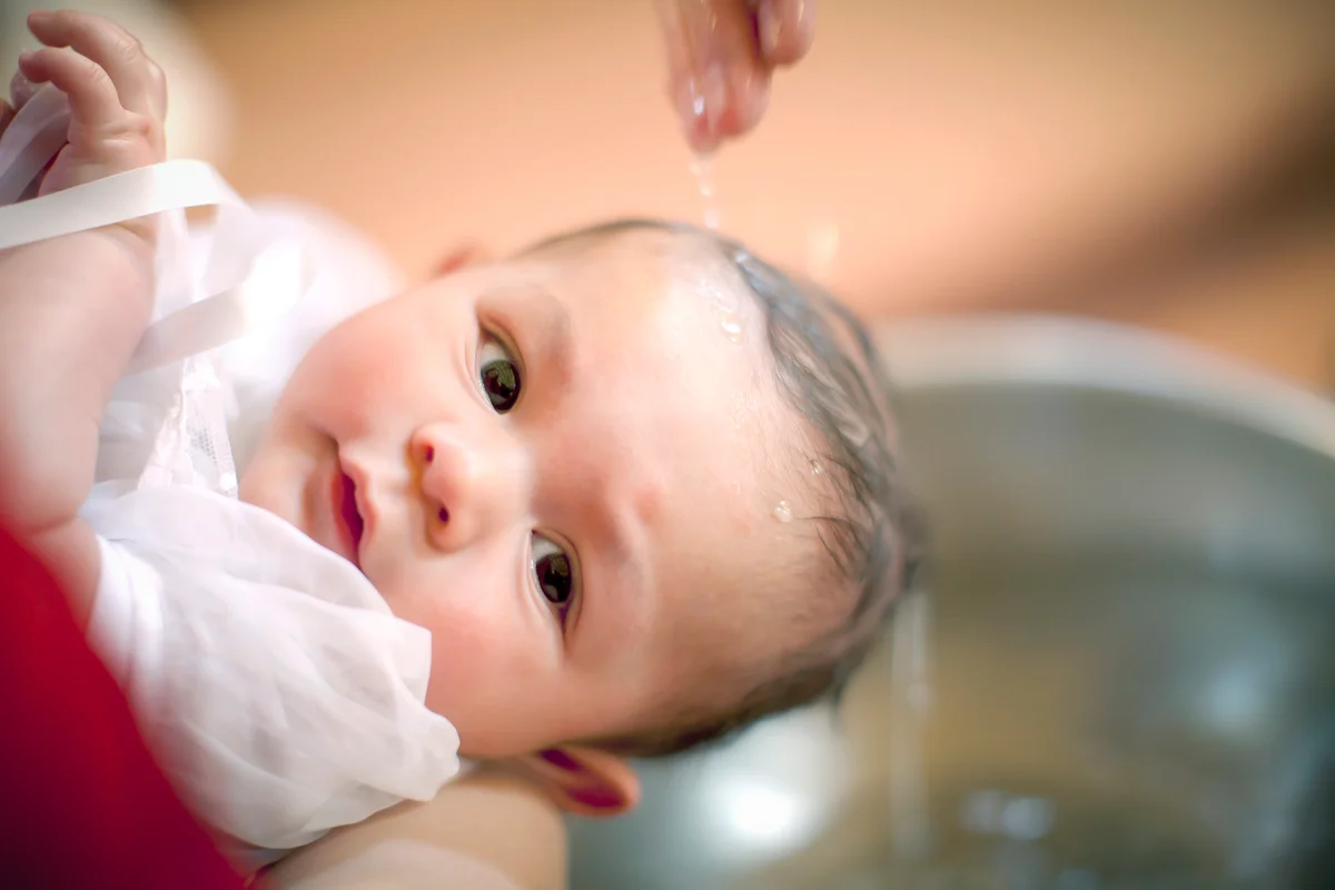 baby boy is baptized in a Catholic Church