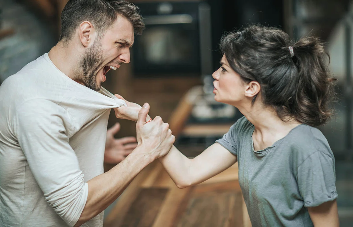 Aggressive couple arguing about their problems at home