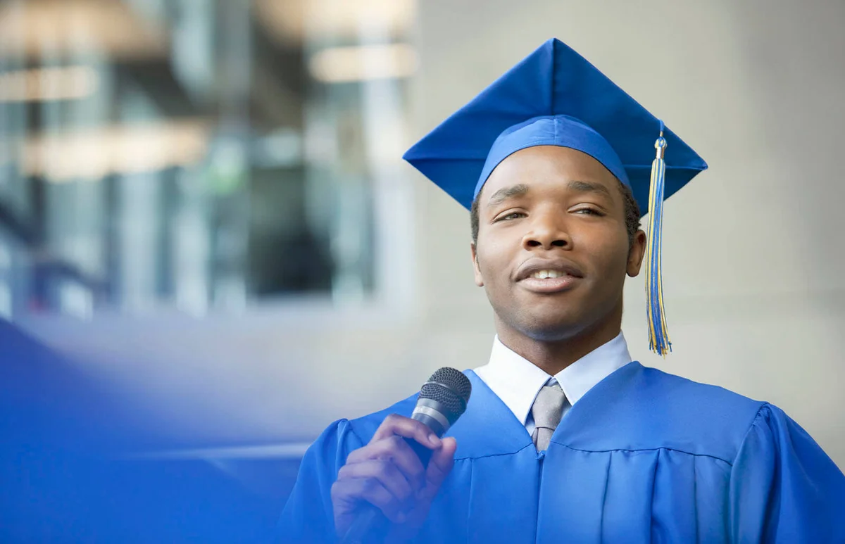 male valedictorian speaking at graduation