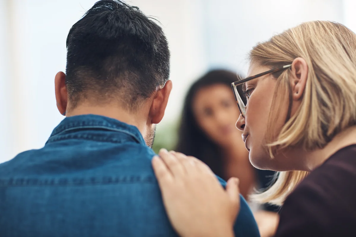 parents comforting one another