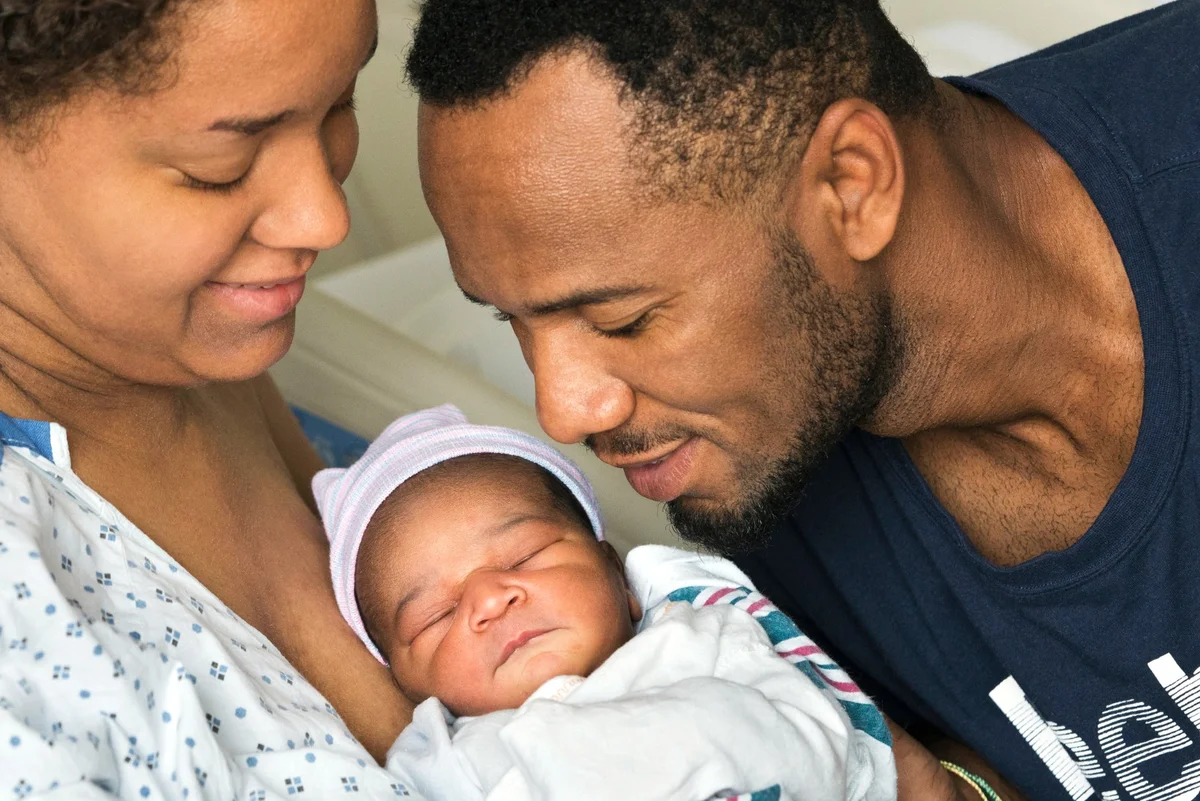 newborn and his parents