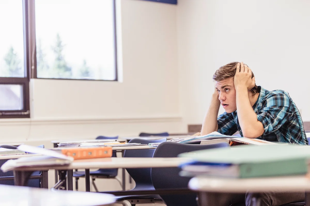 distressed boy in a classroom