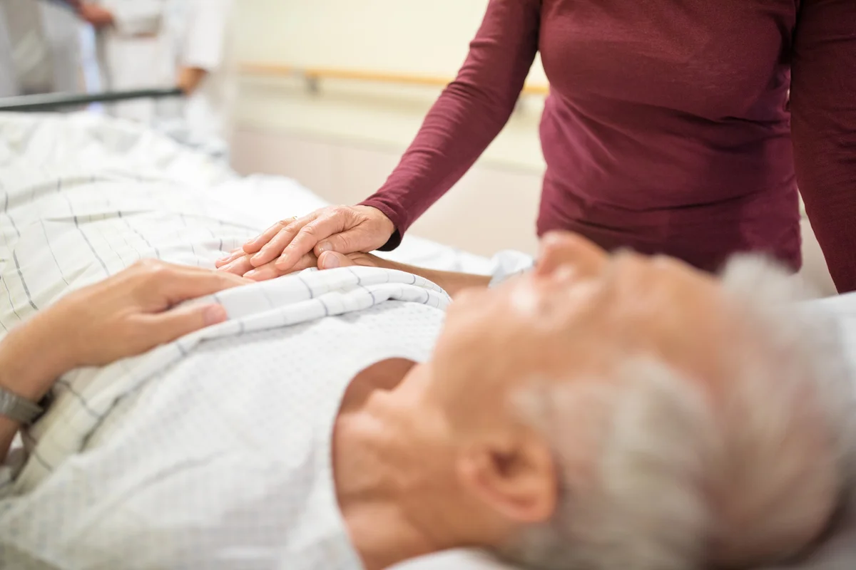 woman with man on death bed