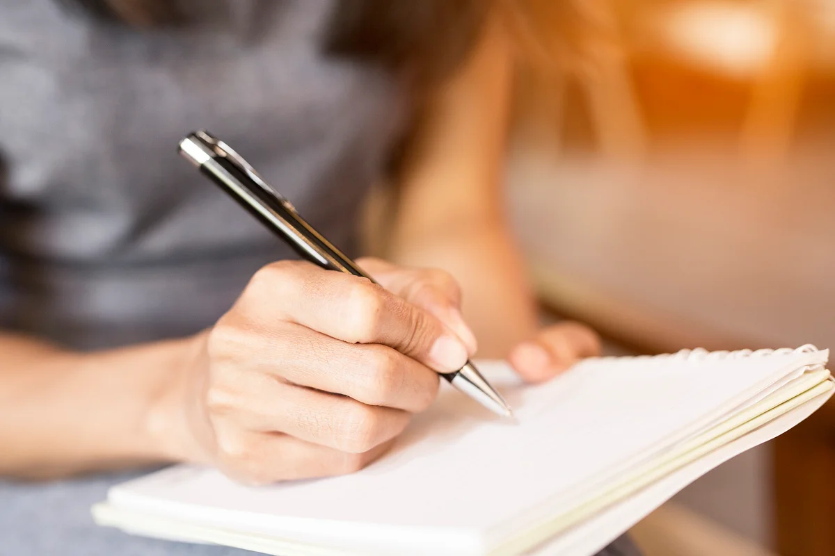 writing in a notebook
