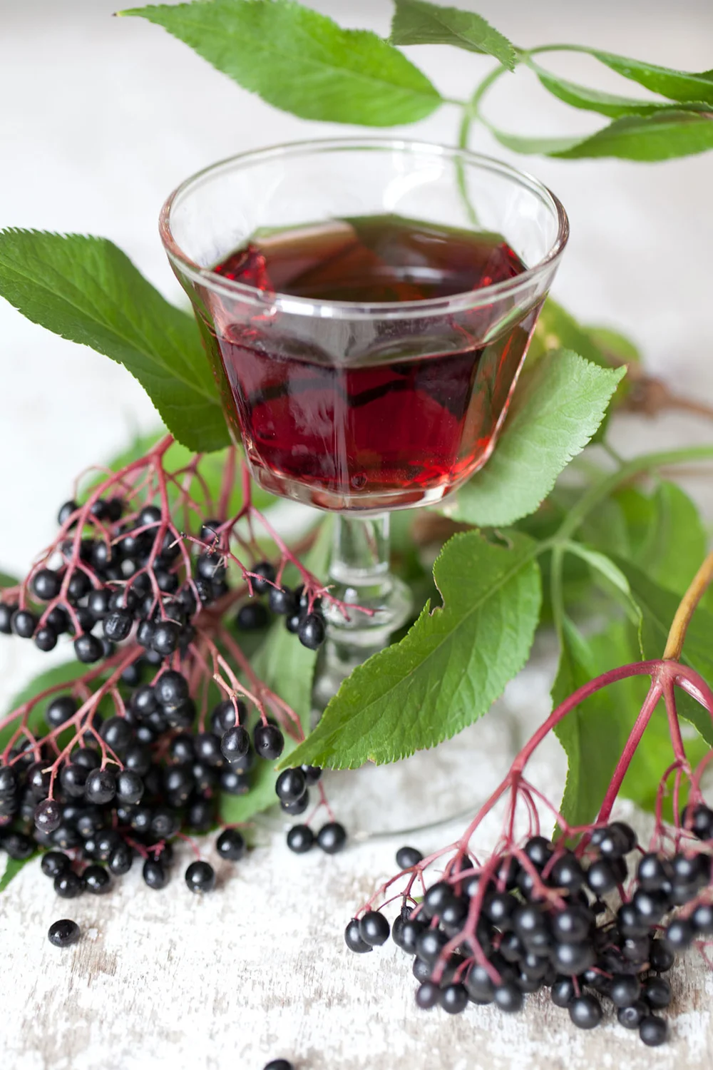 Elderberries and glass of juice