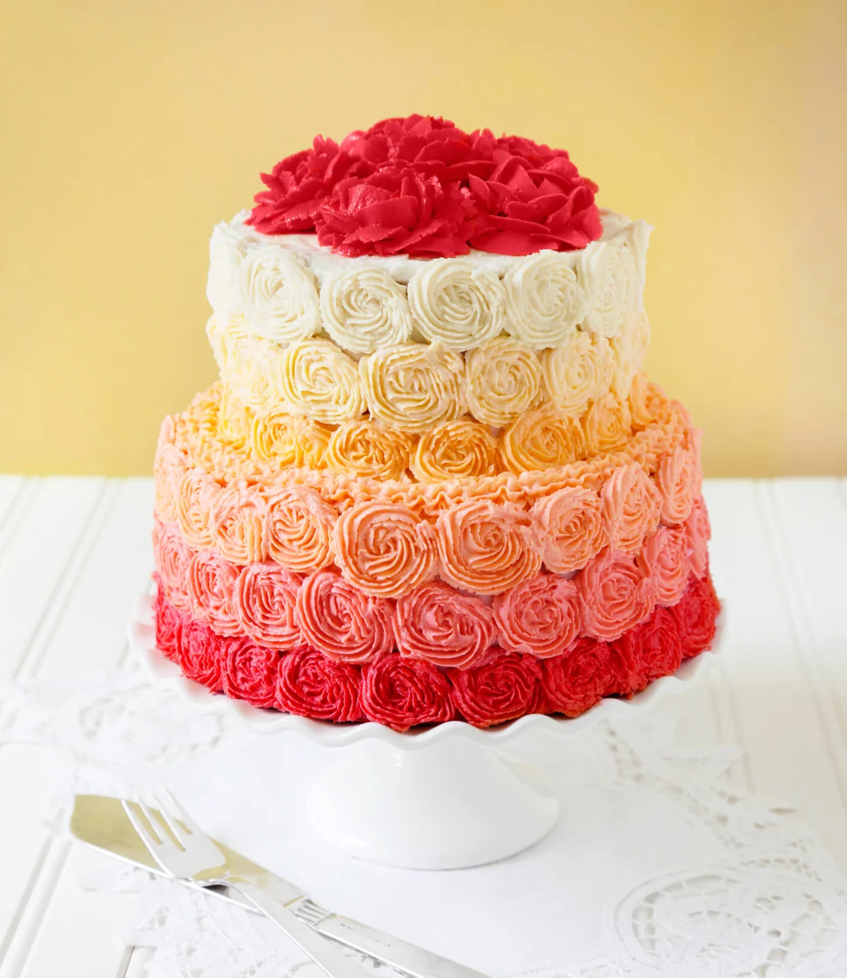 Two tier wedding cake with buttercream rose swirls