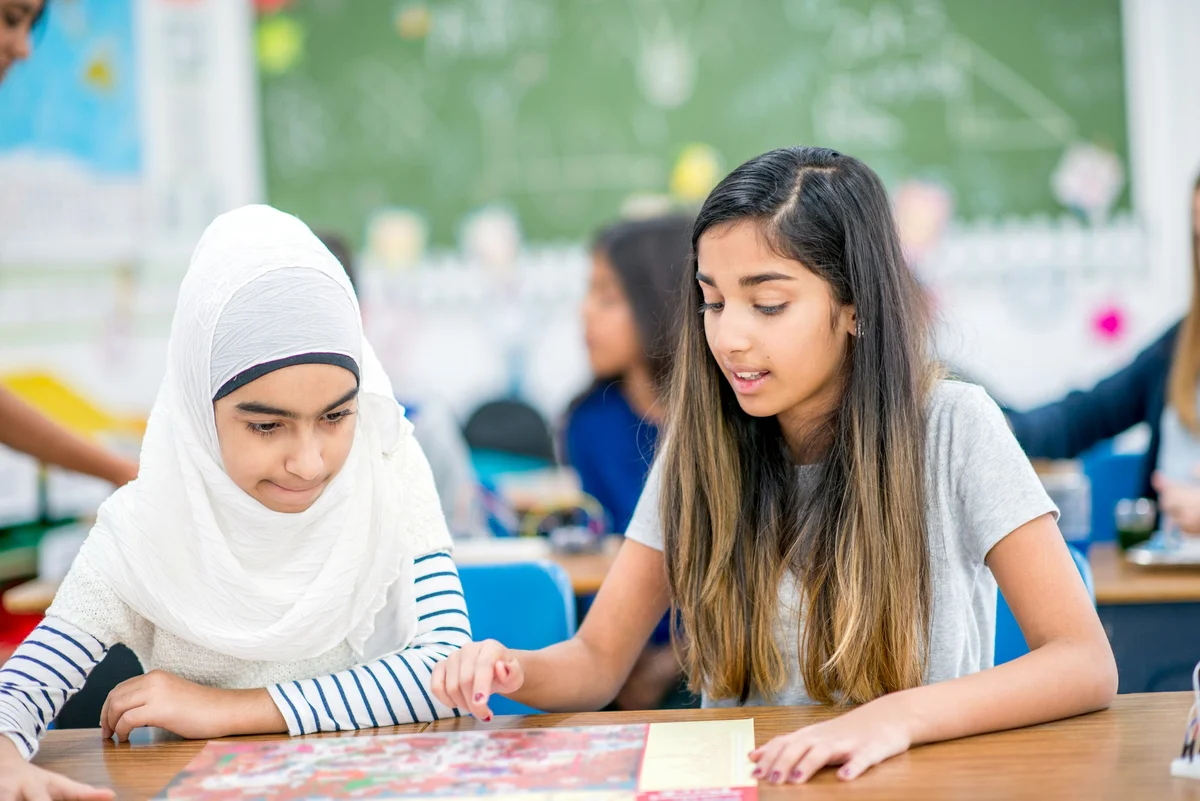two girls playing a board game