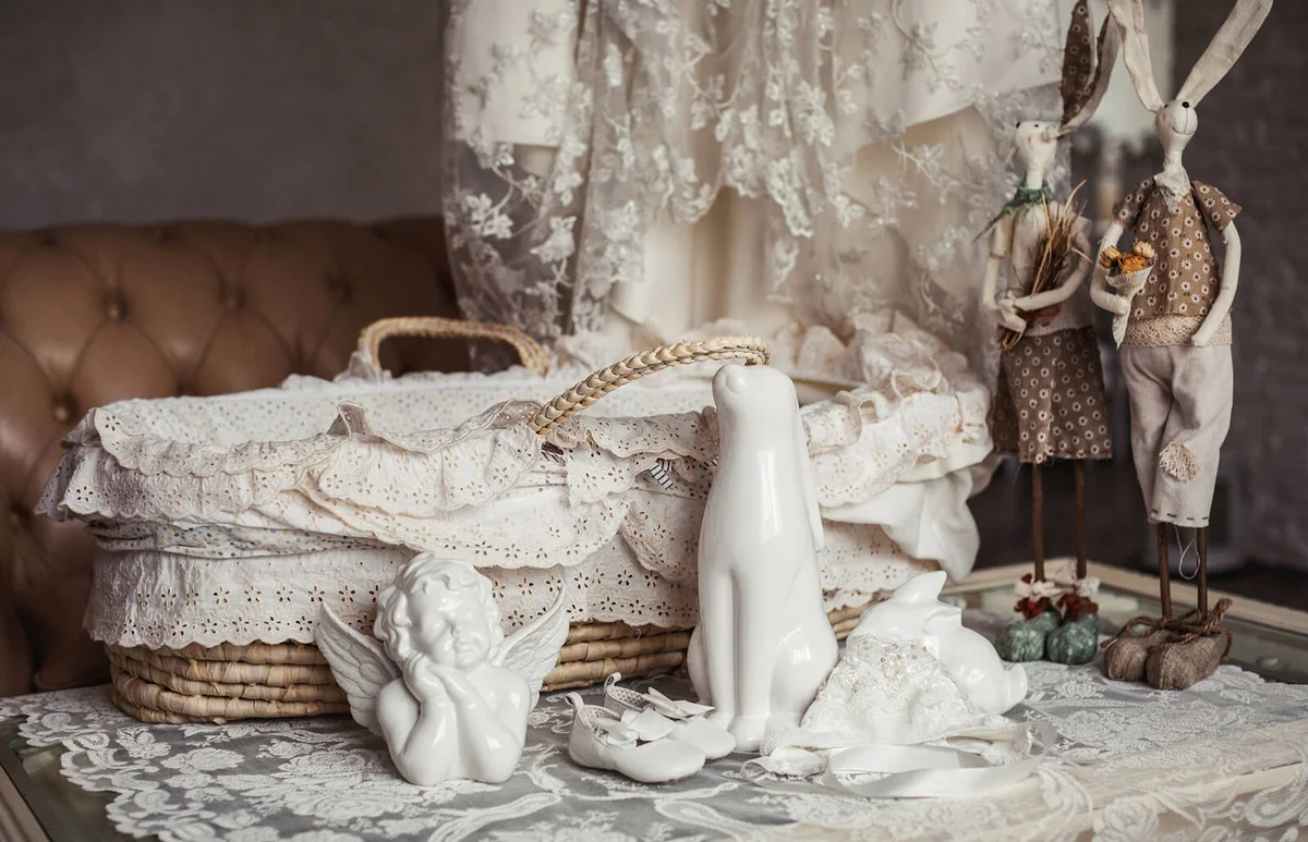 Wicker basket with gifts for baby shower party