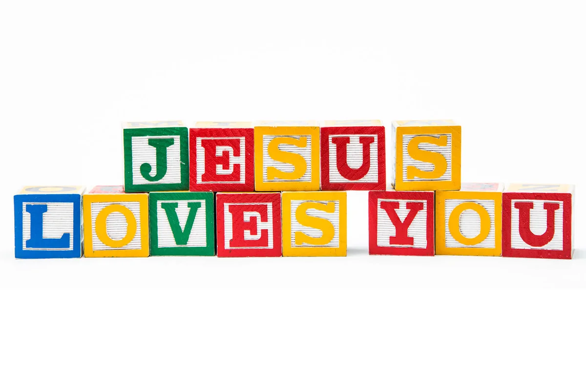 blocks forming the message 'jesus loves you'