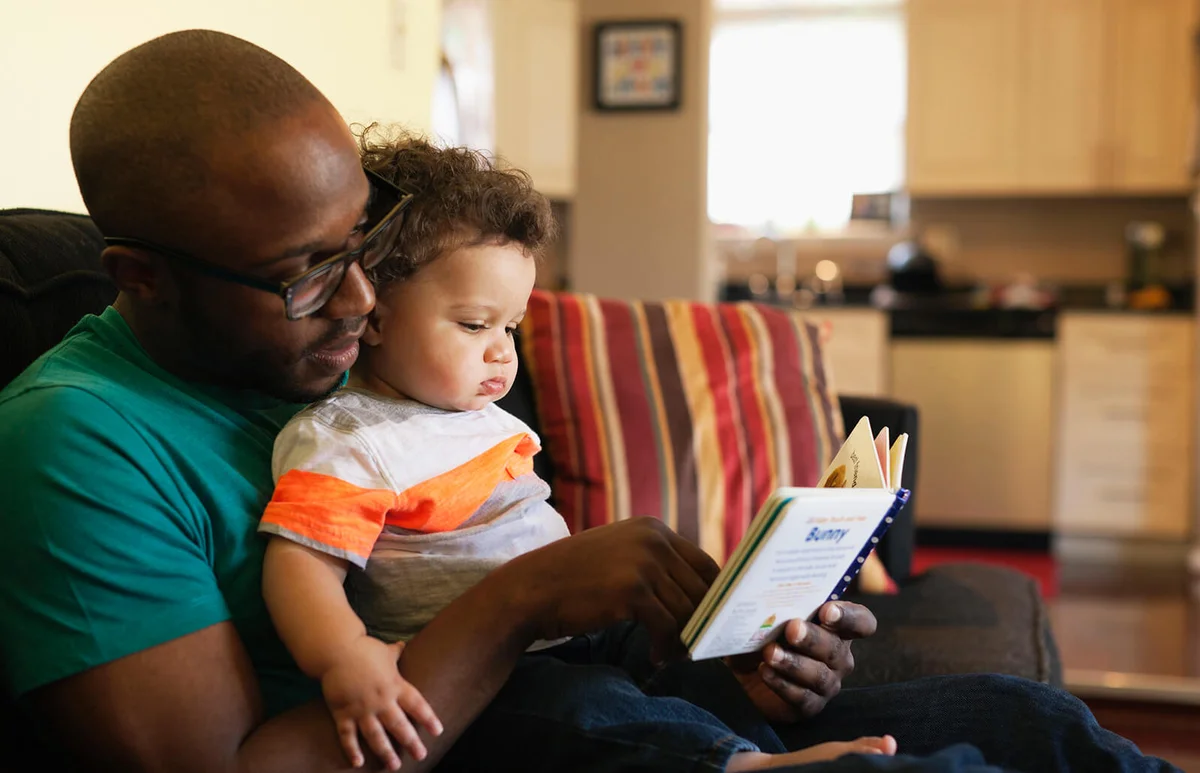Father reading to baby