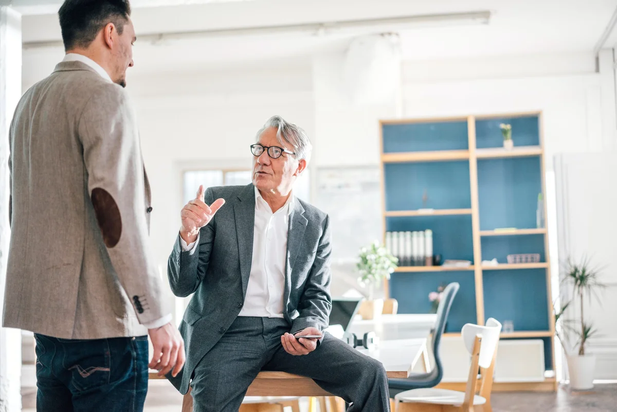 men discussing business