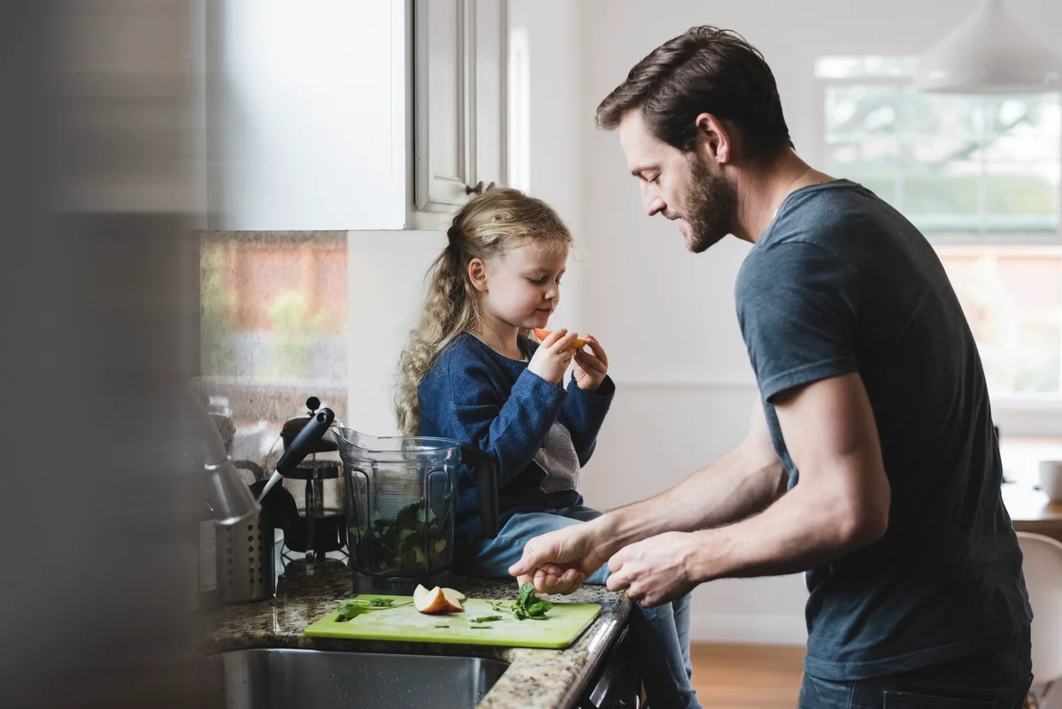 daughter cooking with father