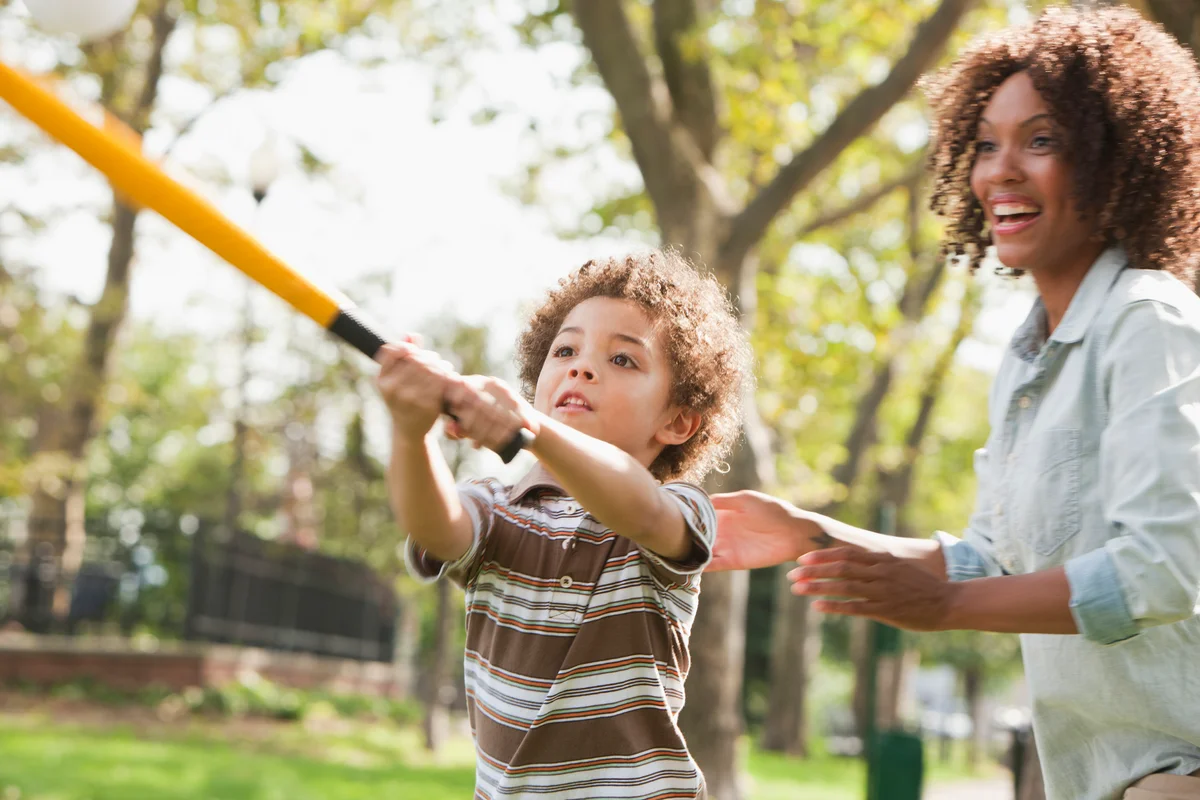mother and son playing baseball