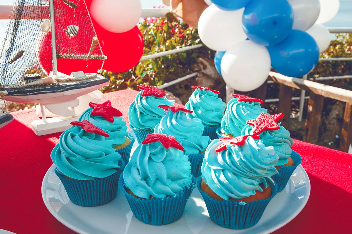 Red starfish on blue frosted cupcakes