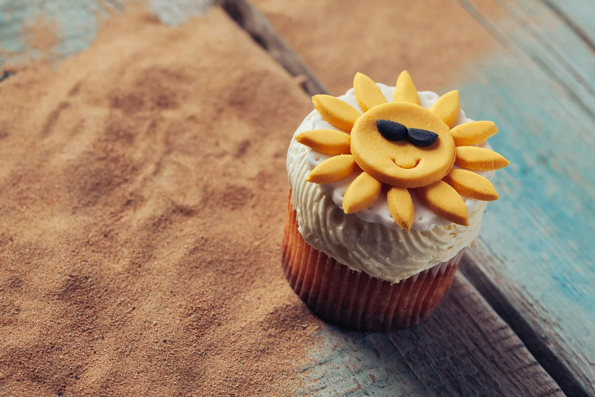 Yellow smiling sun cupcake