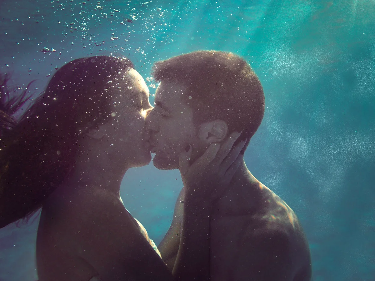 Young couple kissing underwater