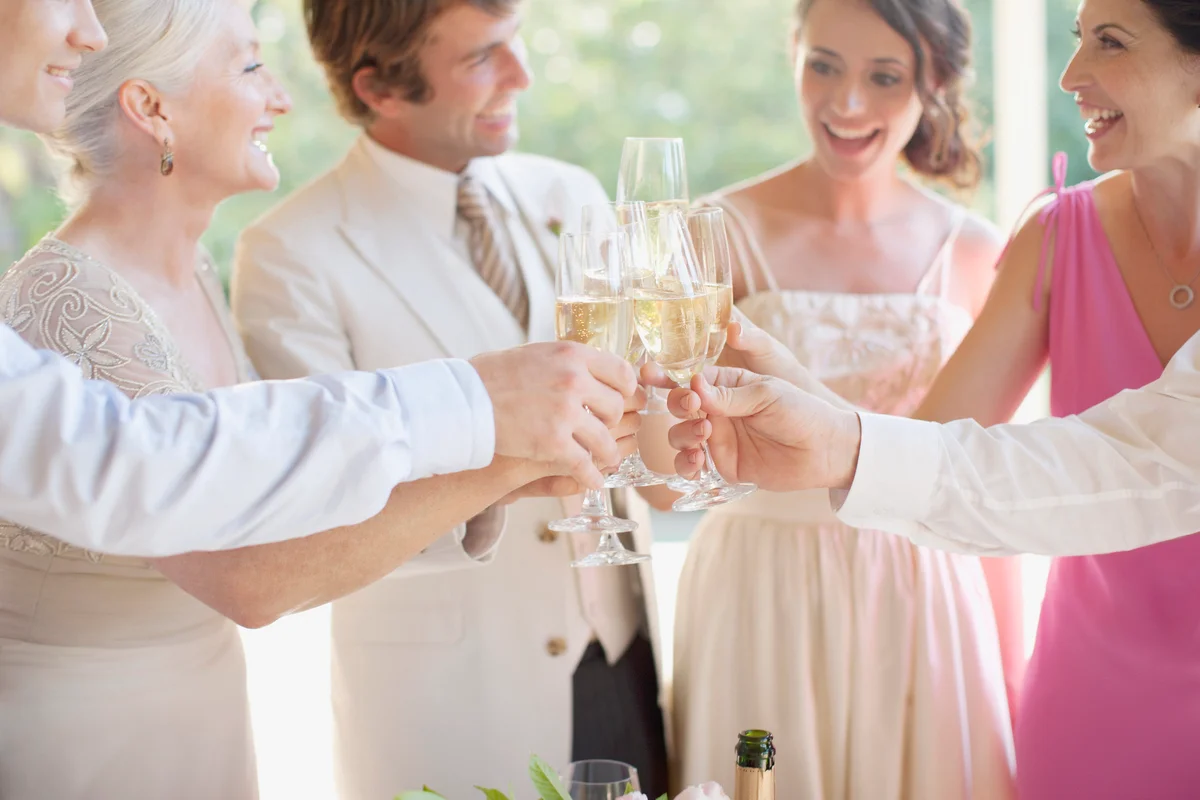 Family toasting with champagne at wedding reception