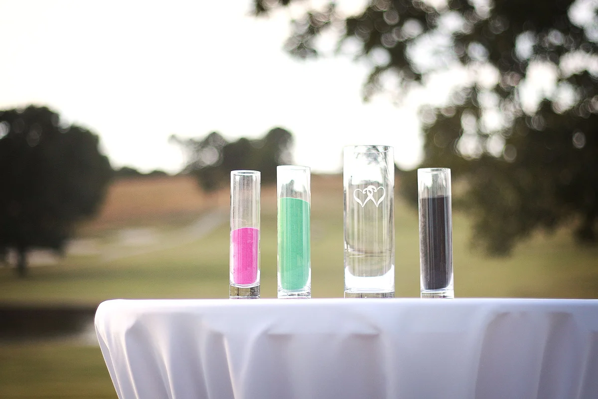Containers of sand on table