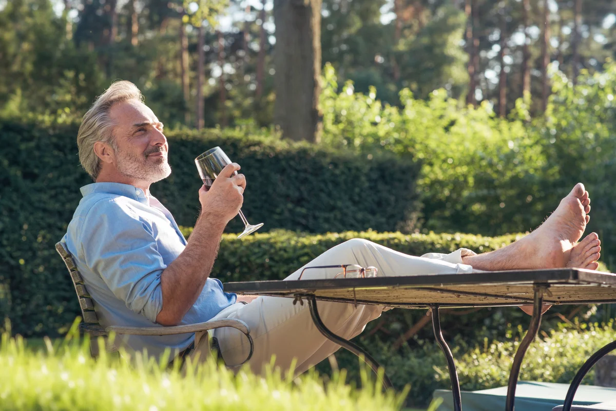 man enjoying glass of wine