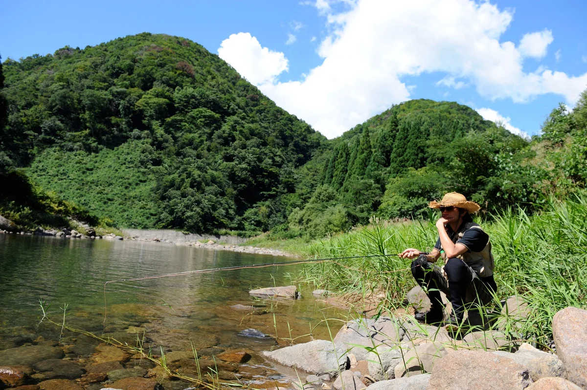 man sitting fishing