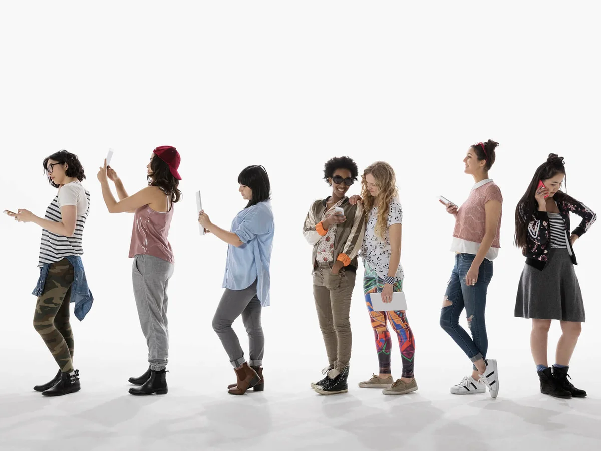 Cool young women using cell phones